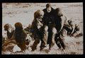 Troops evacuating wounded under fire, Mount Longdon, 1982