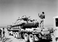 A Cruiser tank moving from one transporter to another, 3rd/4th County of London Yeomanry (Sharpshooters), North Africa, 1942