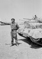 Sandy Longstaff of 3rd County of London Yeomanry fires his .38 inch revolver, North Africa, 1942