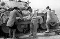 'Washing Day', a tank crew from 3rd County of London Yeomanry (Sharpshooters) attempt to wash clothes in the desert, North Africa, 1942