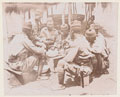 Men of the Gold Coast Regiment stop for a meal at a makeshift table, 1901 (c)