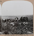 'Gunners digging a gun position for 4.5 howitzer completely concealed by camouflage from Hun armies', 1916 (c)