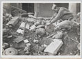 A US Army major inspecting some of the Teller mines found by the American engineers, Leghorn, Italy, 1944