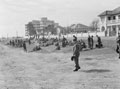 'A gathering on the beach during a route march', 3rd County of London Yeomanry in Cape Town, South Africa, September 1941.