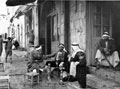'Arabs inside Damascus Gate smoking the hookah (bubbly bubbly)', Jerusalem, Palestine, 1943