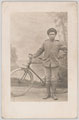 A member of the 55th Company, Chinese Labour Corps, posing with a bicycle in France, 1918 