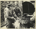 Princess Elizabeth examining the engine of an Austin 10 'Tilly' light utility truck, 1945