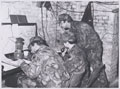 Soldiers from 1st Battalion The Royal Irish Rangers in a temporary command post, Germany, February 1980