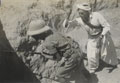 Staged scene of combat with a North West Frontier tribesman with a knife creeping up behind a British soldier with a rifle with fixed bayonet, 1937