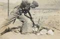 Staged scene of combat with a British soldier bayoneting a North West Frontier tribesman on the ground, 1937
