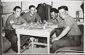 Members of the Royal Electrical and Mechanical Engineers enjoy a break in their duties at Tobruk Camp in the Canal Zone, 1953