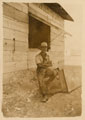 A British soldier smoking a pipe at Sidi Bishr rest camp, Alexandria, Egypt, 1916 