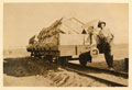 Corporal Joseph Egerton with a rail truck of empty water tanks in Libya, 1916