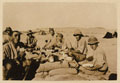British troops eating a meal on sandbags in the desert, 1916 (c)