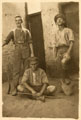 Three British soldiers posing with sticks and a jug, 1916 (c)