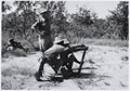 Members of 4th (Uganda) Battalion, King's African Rifles, loading a 2-inch mortar, 1956 (c)