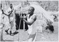 Soldiers from the 4th (Uganda) Battalion, King's African Rifles, constructing a traditional hut, 1956-1957 (c)