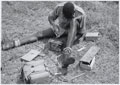 An orderly, 4th (Uganda) Battalion, King's African Rifles, 'boxing up' his kit  for an inspection, 1956 (c)