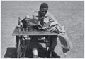 The Company 'fundi' or tailor, 4th (Uganda) Battalion, King's African Rifles, 1956 (c)
