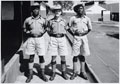 Lieutenant Roger Perkins with two African NCOs, 4th (Uganda) Battalion, King's African Rifles, 1956-1957 (c)
