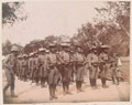 Soldiers of the 1st Chinese Regiment parade in field dress, 1900 (c)