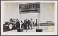 German prisoners of war under guard by a signpost to El Alamein, 1942