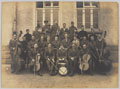 An orchestra of British officers in front of a barrack block at Holzminden Camp, Germany, 1918