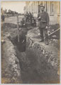 Partially excavated tunnel from a barrack block crossing a wire fence at Holzminden Camp, 1918