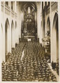 'German soldiers crowding Antwerp Cathedral. Usually they prefer bombarding Cathedrals to praying in them', 1914