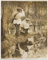 A British sniper team patrol in a wood, 1915 (c)