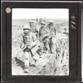 A German prisoner is escorted in by Grenadier Guardsmen near Ginchy, 25 September 1916