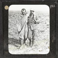 A British soldier helping a wounded German prisoner, 25 September 1916