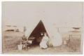Regimental Sergeant Arthur Harrington with his wife outside a tent at a London Rifle Brigade territorial camp, 1913 (c)