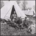 Rifleman William Eve and comrades of 1/16th (County of London) Battalion, The London Regiment, outside their tent, 1914