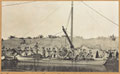 Guns from 1/5th Hampshire Howitzer Battery being loaded onto a raft at Basra, 1915