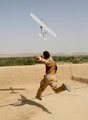 A gunner launches a  Desert Hawk Unmanned Aerial Vehicle (UAV), Helmand Province, Afghanistan, 2008