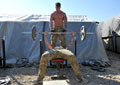 Soldiers weightlifting in camp, Helmand Province, Afghanistan, 2011