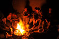 Soldiers of 2nd Battalion, Parachute Regiment, seated around a fire in Afghanistan, 2011