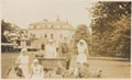 Wounded officers and nursing sisters in the gardens at Queen Mary's Convalescent Auxiliary Hospital, Dover House, 1918