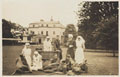Nursing sisters and wounded officers in the gardens at Queen Mary's Convalescent Auxiliary Hospital, Dover House, 1918