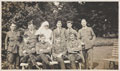 Scottish officers with a nursing sister in the gardens at Queen Mary's Convalescent Auxiliary Hospital, Dover House, 1918