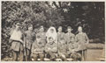 Scottish officers with a nursing sister in the gardens at Queen Mary's Convalescent Auxiliary Hospital, Dover House, 1918