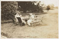 Wounded officers and nursing sisters enjoying tea in the gardens at Queen Mary's Convalescent Auxiliary Hospital, Dover House, 1918