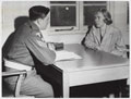 An Intelligence Corps staff sergeant questioning a civilian, 1960 (c)