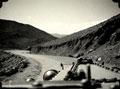 'From the safety of an armoured car. On the road to Miranshah. Sub-section making good a dangerous bend', Waziristan, 1937