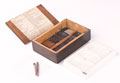 Box of watercolour paint blocks, palette and brush, 1940 (c)