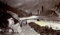 Civilian party near a river bridge, India, 1910 (c)