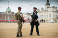 A soldier from 2nd Battalion The Parachute Regiment, with a member of the Metropolitan Police, Operation TEMPERER, Horse Guards, London, 29 May 2017