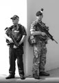 A soldier from 1st Battalion, The Royal Regiment of Fusiliers, provides security in central London, alongside an armed member of the Ministry of Defence Police, Operation TEMPERER, 28 May 2017