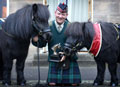 Pony Major Corporal Mark Wilkinson, Royal Regiment of Scotland, with current and former mascots, 'Cruachan III' and 'Cruachan IV', 2015
